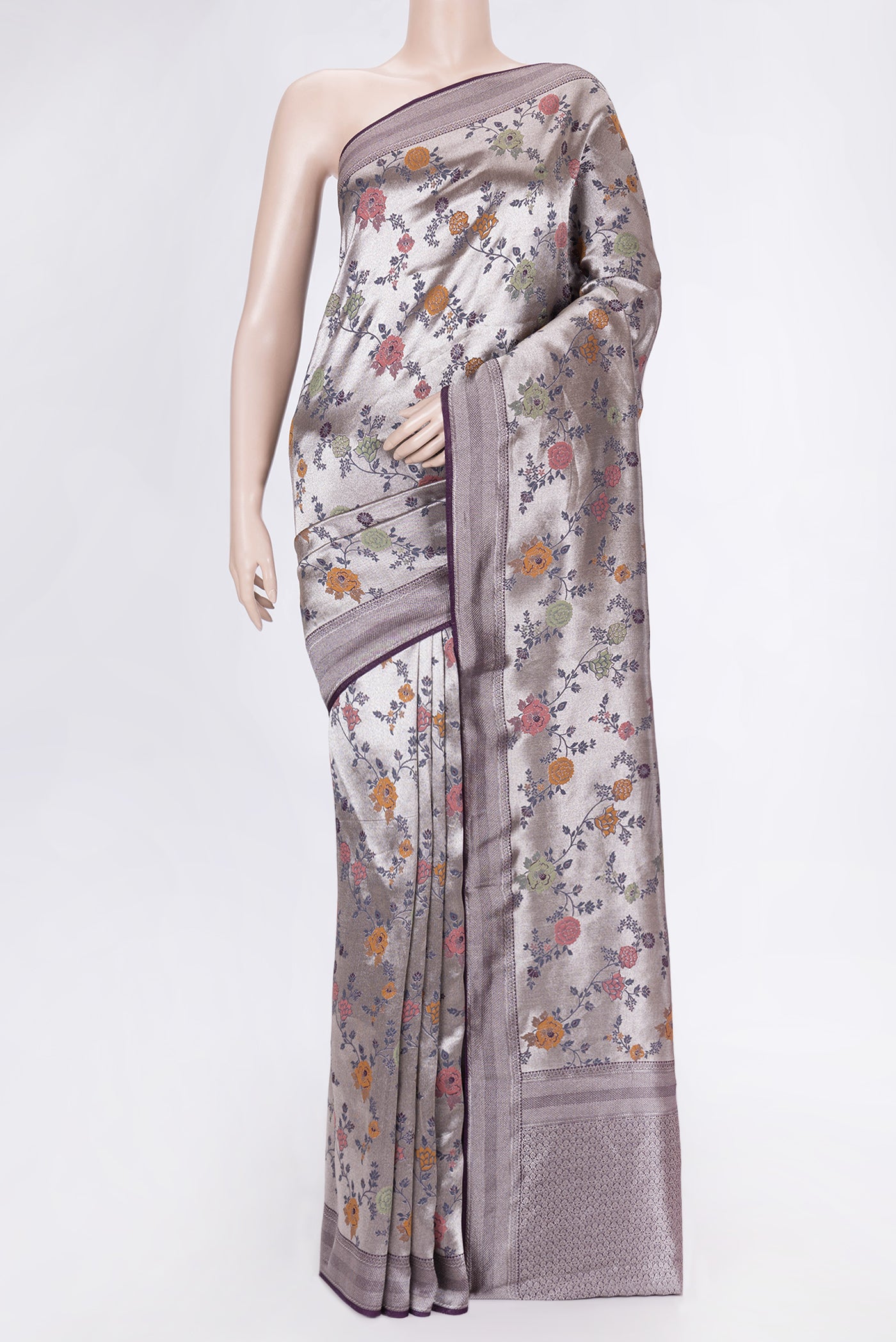 Purple Dual Tone Organza Silk Saree with Zari And Thread Butta on the body and Zari Border.  displayed on a mannequin