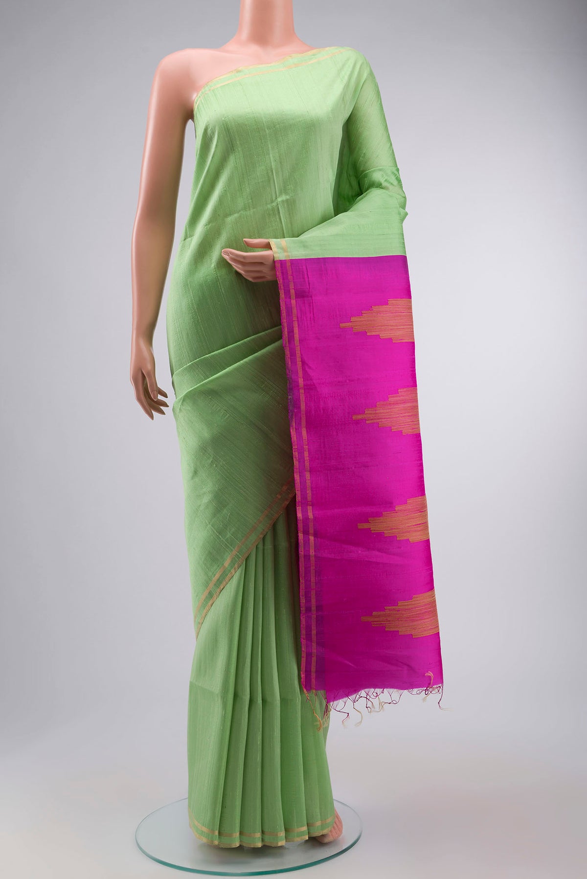 Green Raw Silk Saree with Plain Body and Zari Border displayed on a mannequin