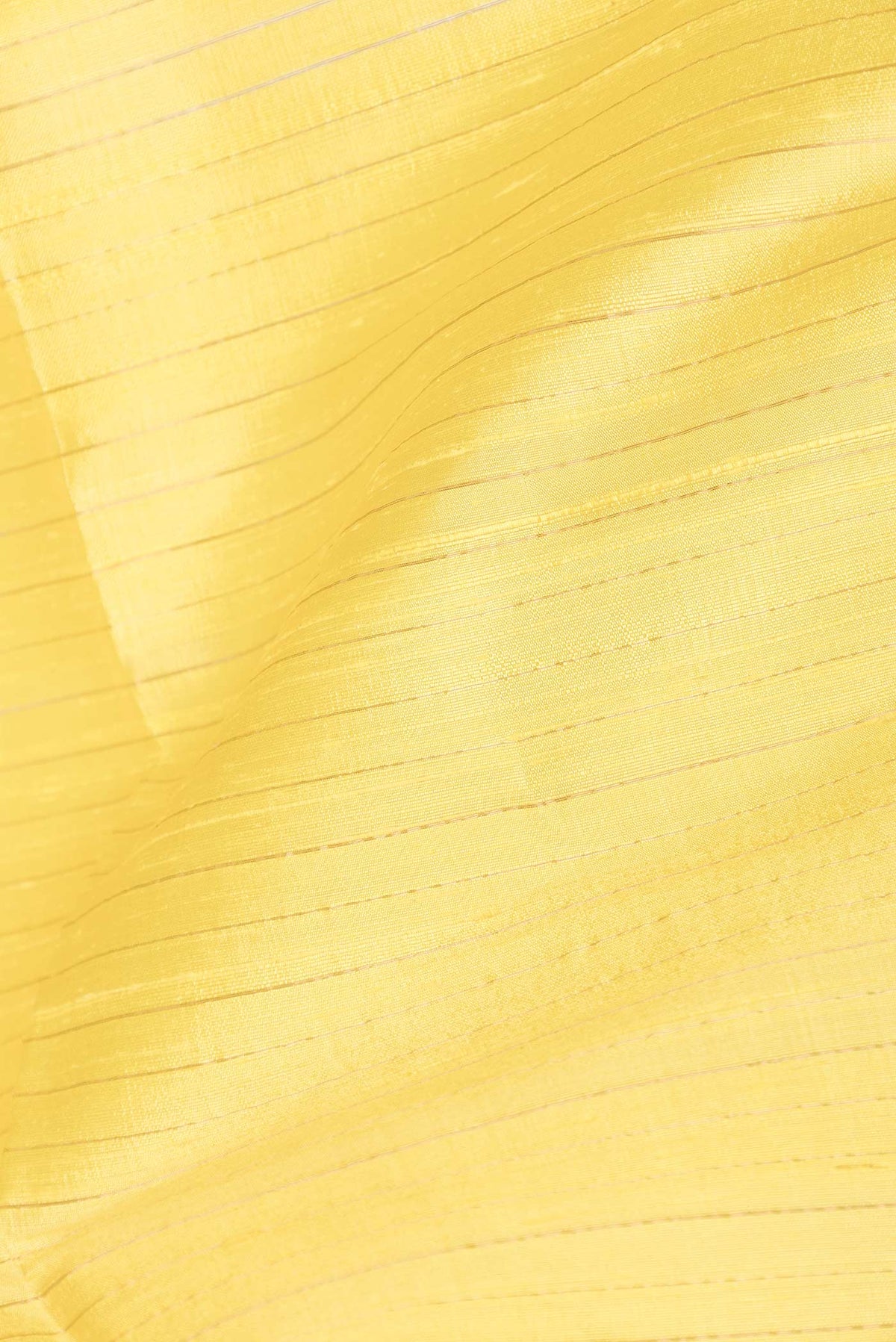 Close up of Yellow Dual Tone Raw Silk Saree with Stripes on the body and Zari Border displaying folds
