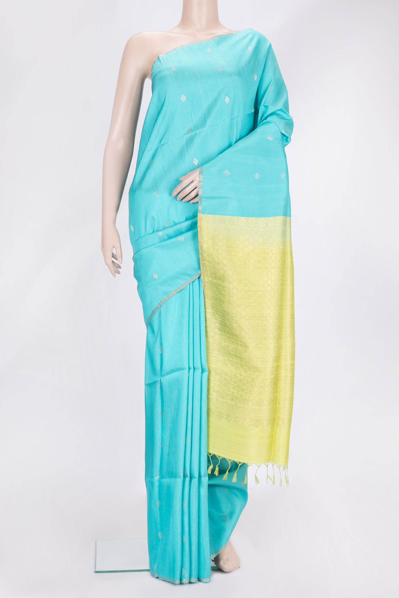 Sky Blue Dual Tone Raw Silk Saree with Zari Butta on the body and Zari Border.  displayed on a mannequin