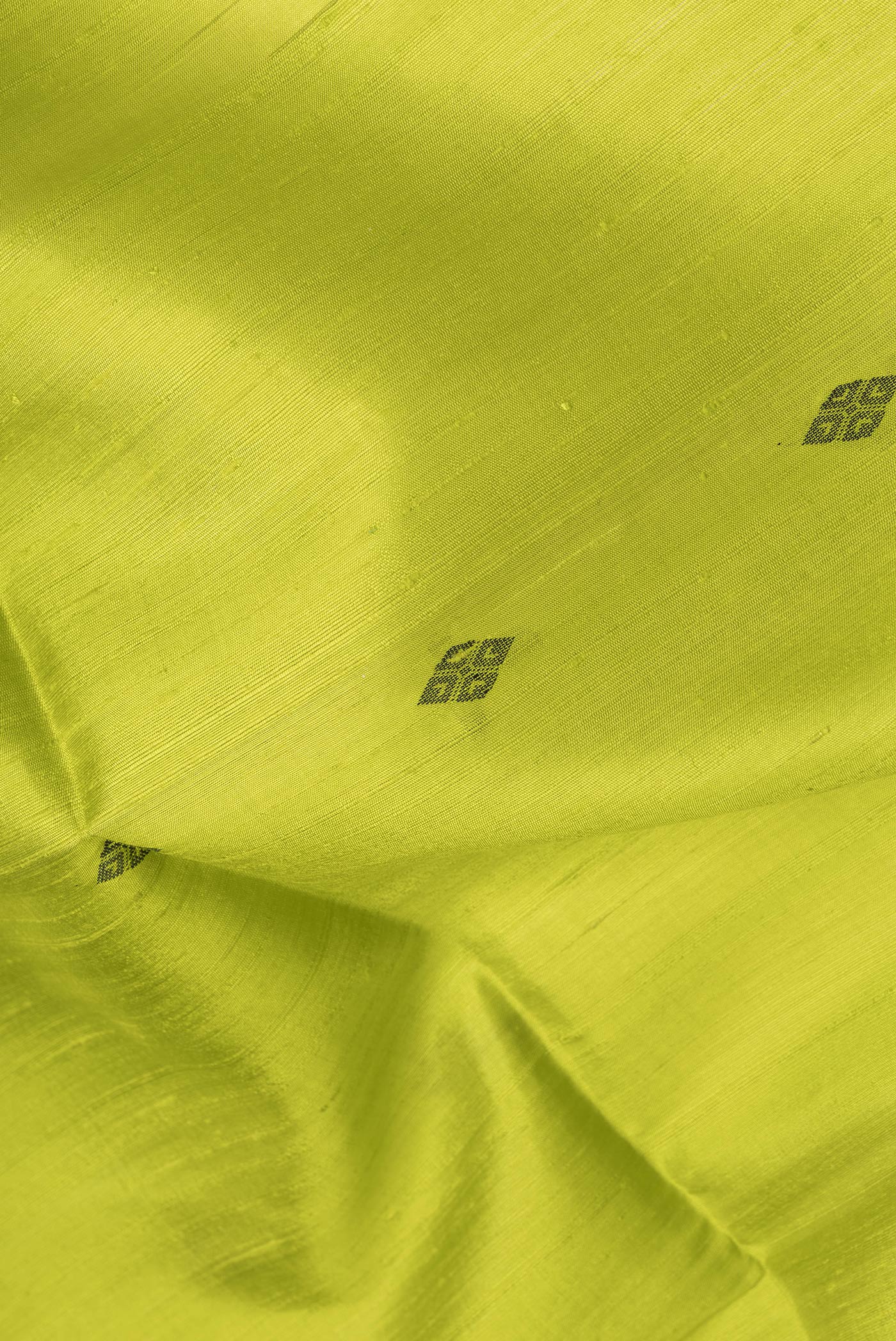 Close up of Parrot Green Dual Tone Raw Silk Saree with Thread Butta on the body and Thin Zari Line.  displaying folds