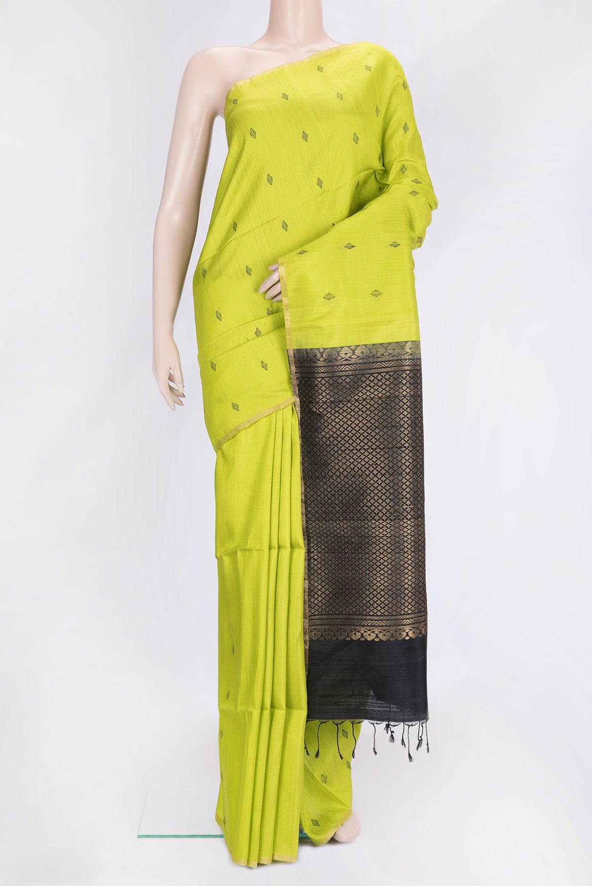 Parrot Green Dual Tone Raw Silk Saree with Thread Butta on the body and Thin Zari Line.  displayed on a mannequin
