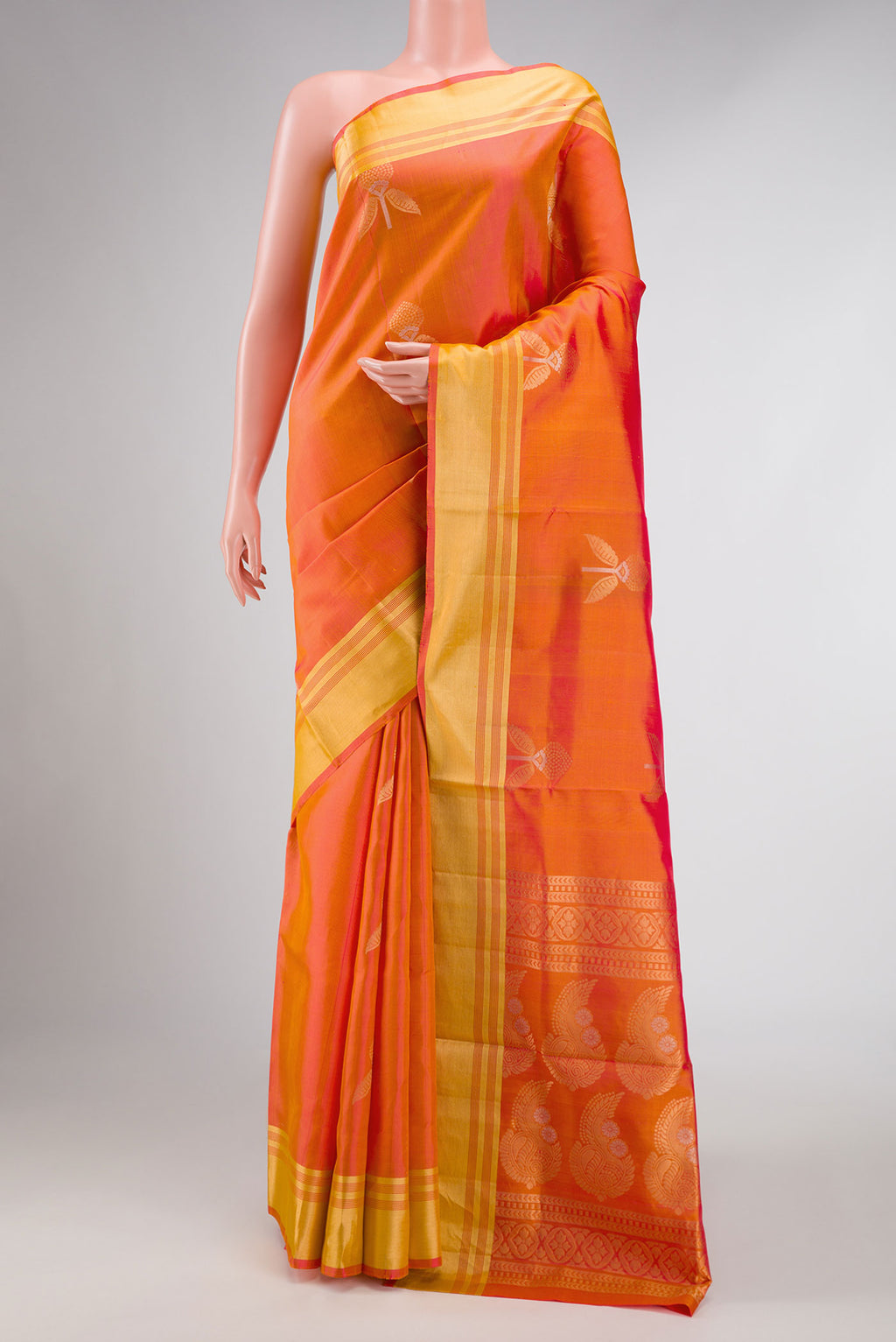 Orange Dual Tone Soft Silk Saree with Zari Butta on the body and Zari Border displayed on a mannequin