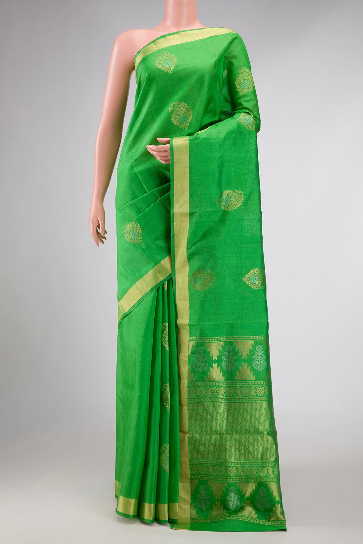 Green Dual Tone Soft Silk Saree with Zari Butta on the body and Zari Border displayed on a mannequin