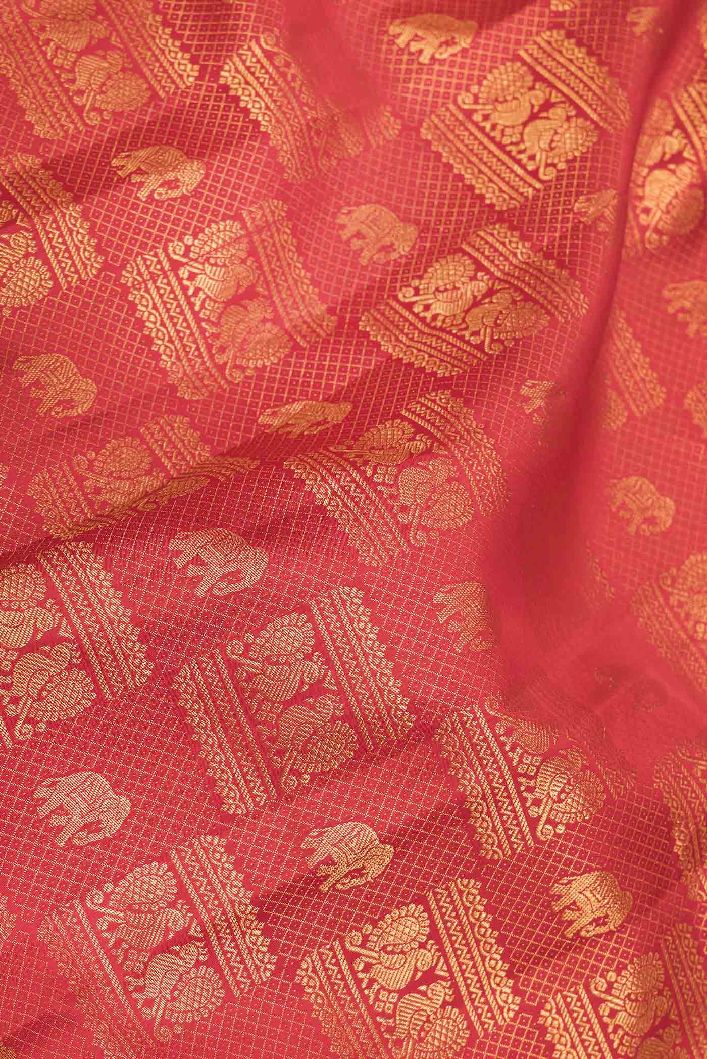 Close up of Red Dual Tone Kanchipuram Saree with Zari Brocade on the body and Zari Border displaying folds