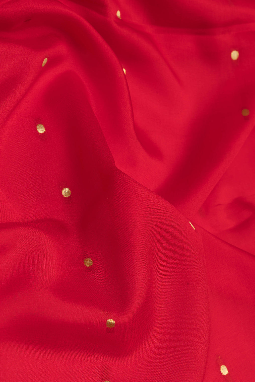 Close up of Red Mysore Silk Saree with Zari Butta on the body and Zari Border.  displaying folds