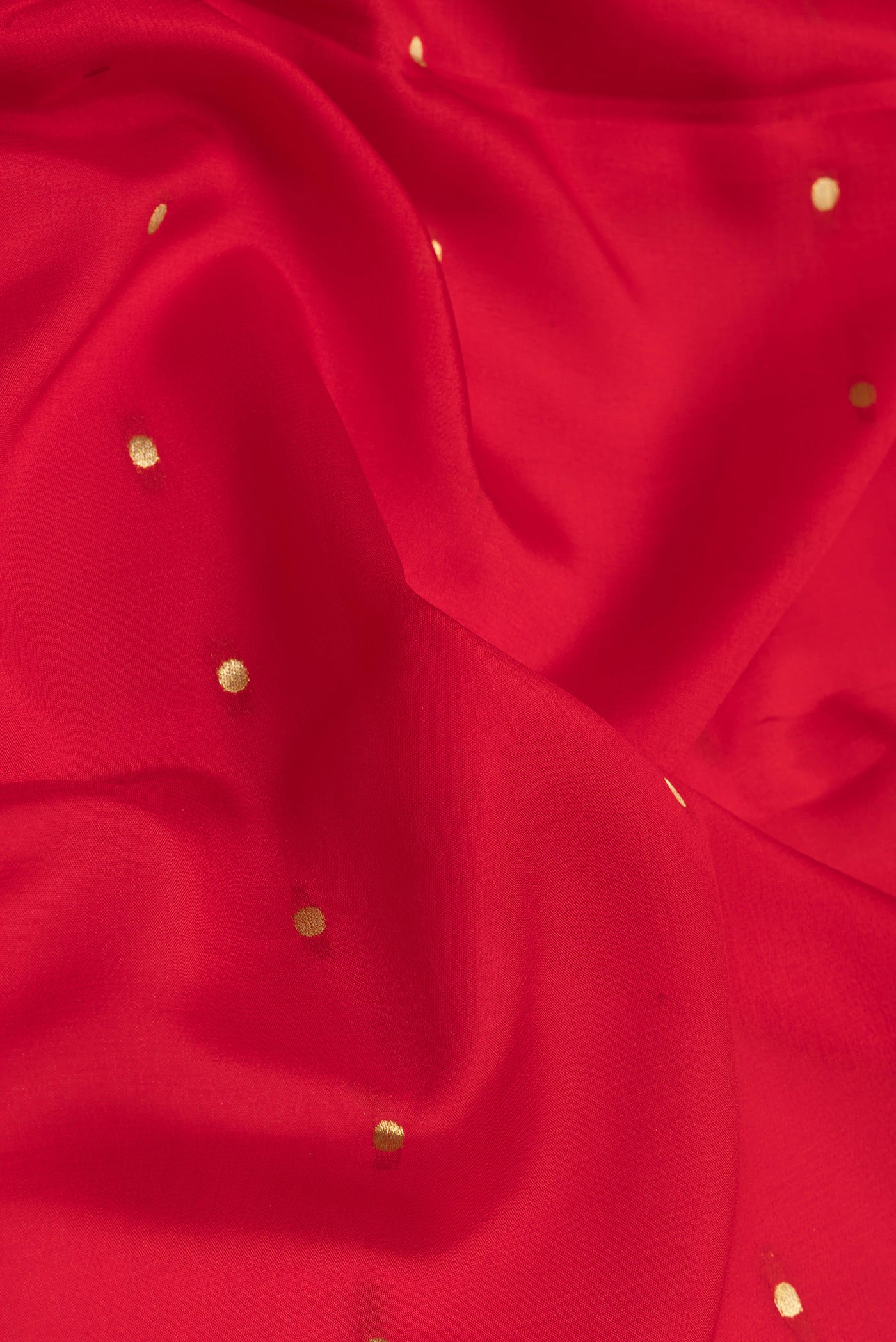 Close up of Red Mysore Silk Saree with Zari Butta on the body and Zari Border.  displaying folds