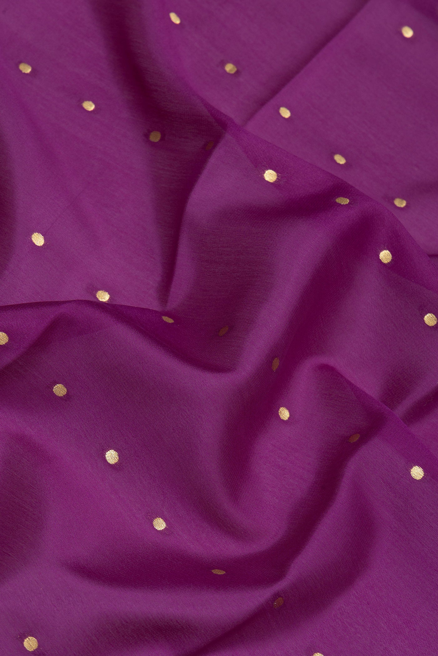 Close up of Magenta Mysore Silk Saree with Zari Butta on the body and Zari Border.  displaying folds