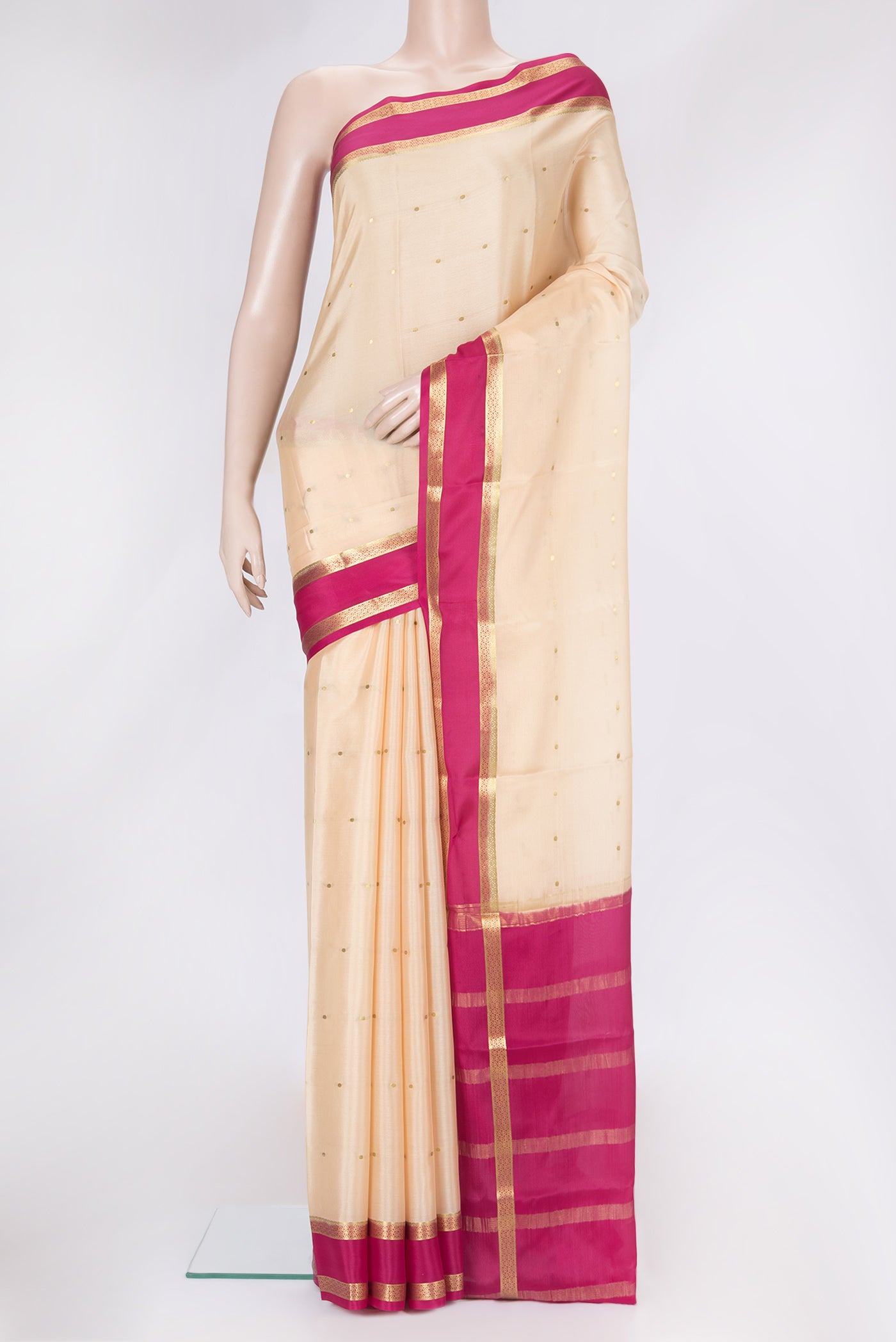 Beige Dual Tone Mysore Silk Saree with Zari Butta on the body and Zari Border.  displayed on a mannequin
