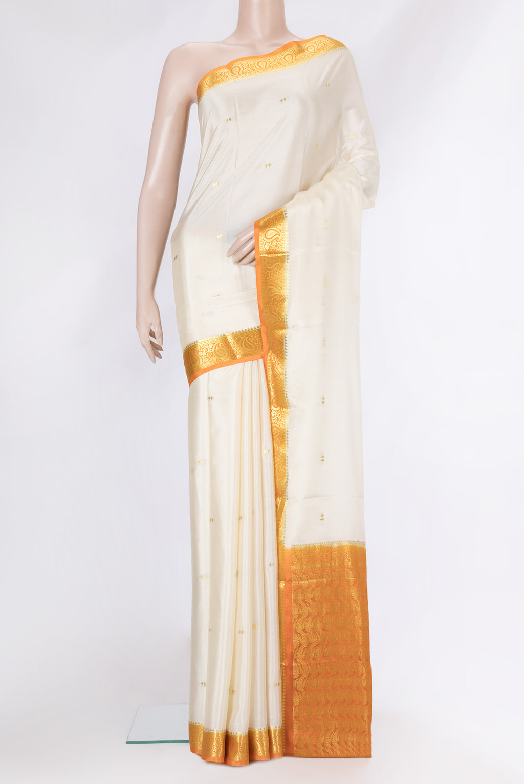 Beige Dual Tone Mysore Silk Saree with Zari Butta on the body and Zari Border.  displayed on a mannequin
