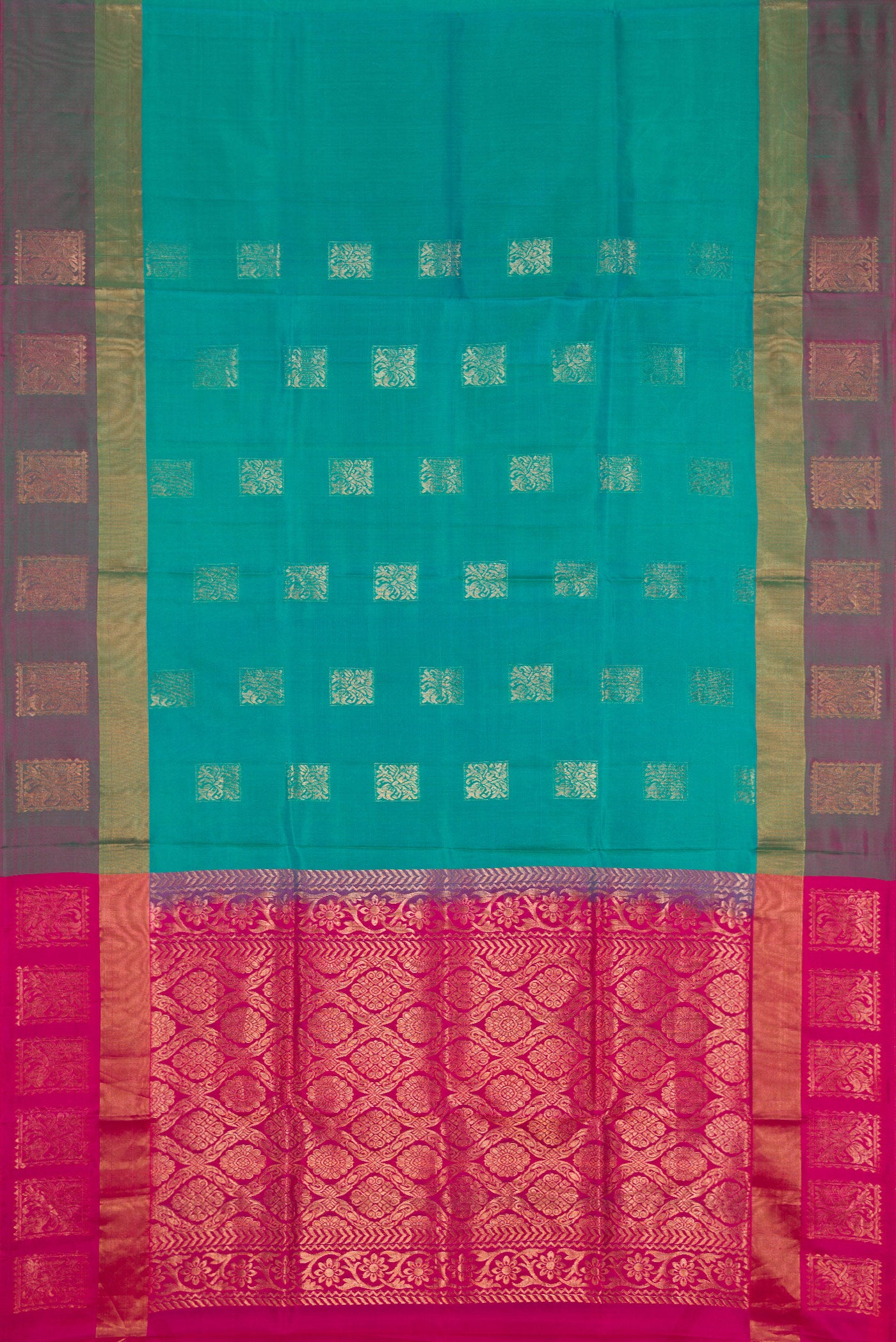 Peacock Blue Dual Tone Soft Silk Saree with Zari Butta on the body and Fancy Border.  displayed on a mannequin