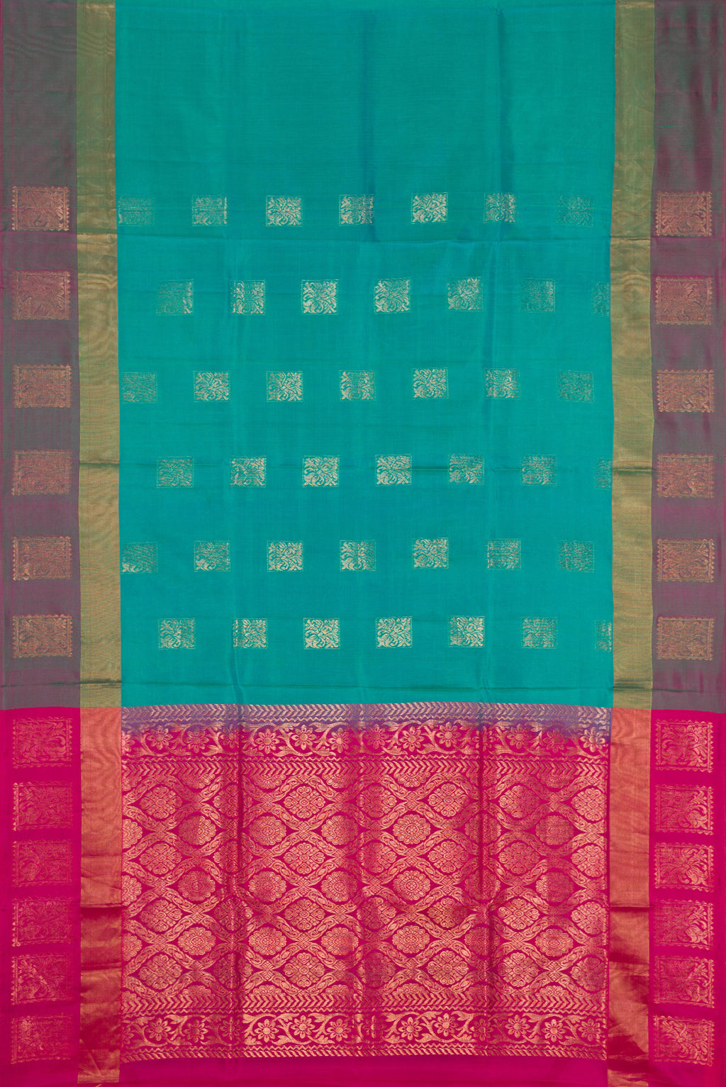 Flat view of Peacock Blue Dual Tone Soft Silk Saree with Zari Butta on the body and Fancy Border. 