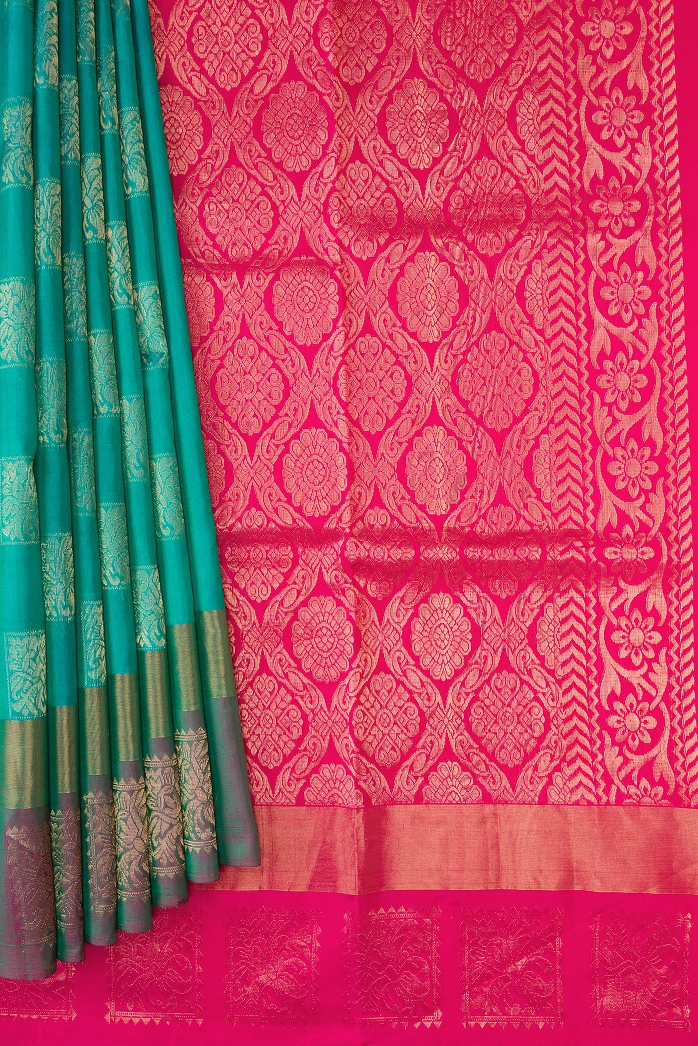 Pleats and pallu of Peacock Blue Dual Tone Soft Silk Saree with Zari Butta on the body and Fancy Border. 