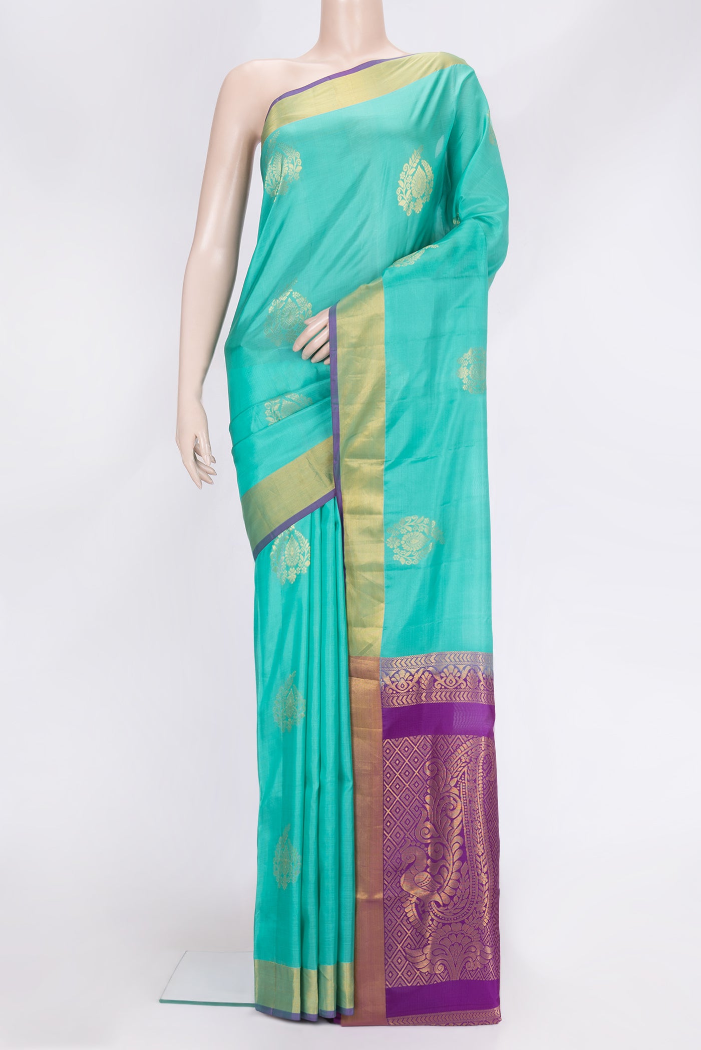 Sea Green Dual Tone Soft Silk Saree with Zari Butta on the body and Zari Border.  displayed on a mannequin