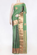 Green Dual Tone Kanchipuram Saree with Zari Butta on the body and Zari Border displayed on a mannequin