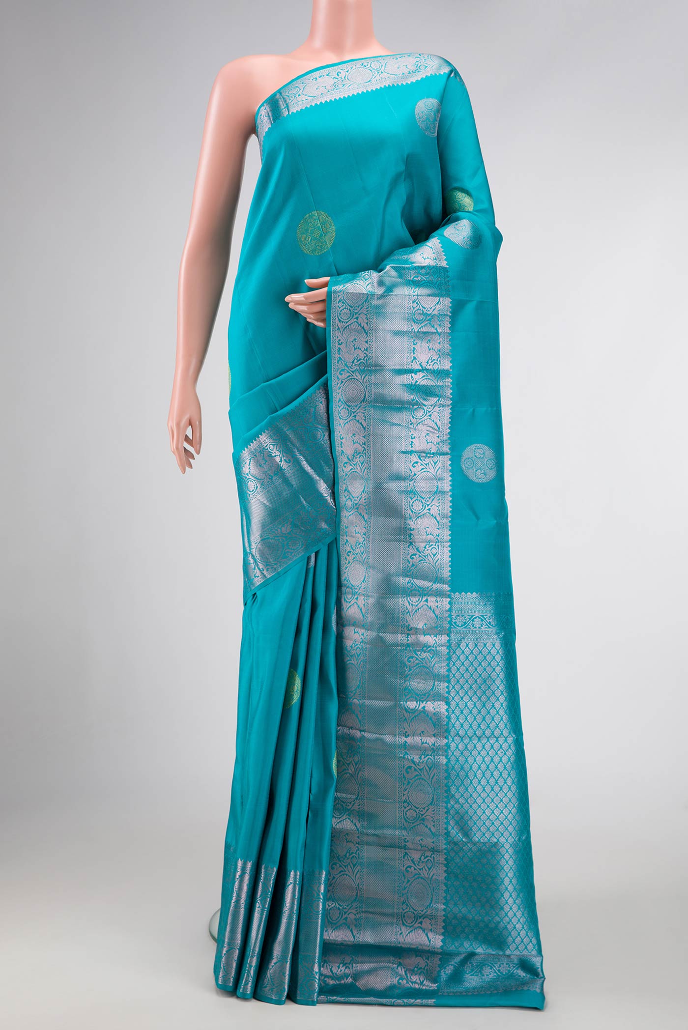 Sky Blue Dual Tone Kanjivaram Silk Saree with Zari Brocade on the body and Zari Border.  displayed on a mannequin
