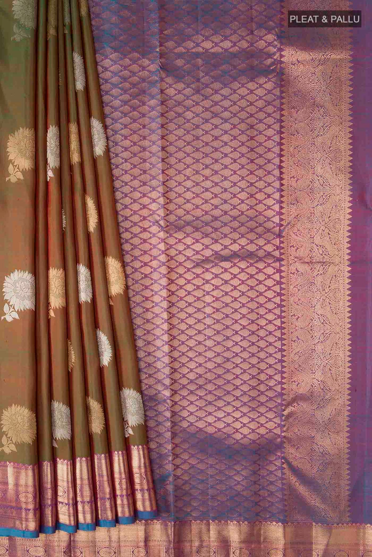 Pleats and pallu of Green Kanchipuram Silk Saree with Zari Butta on the body and Zari Border