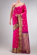 Pink Dual Tone Kanjivaram Silk Saree with Zari Butta on the body and Zari Border.  displayed on a mannequin