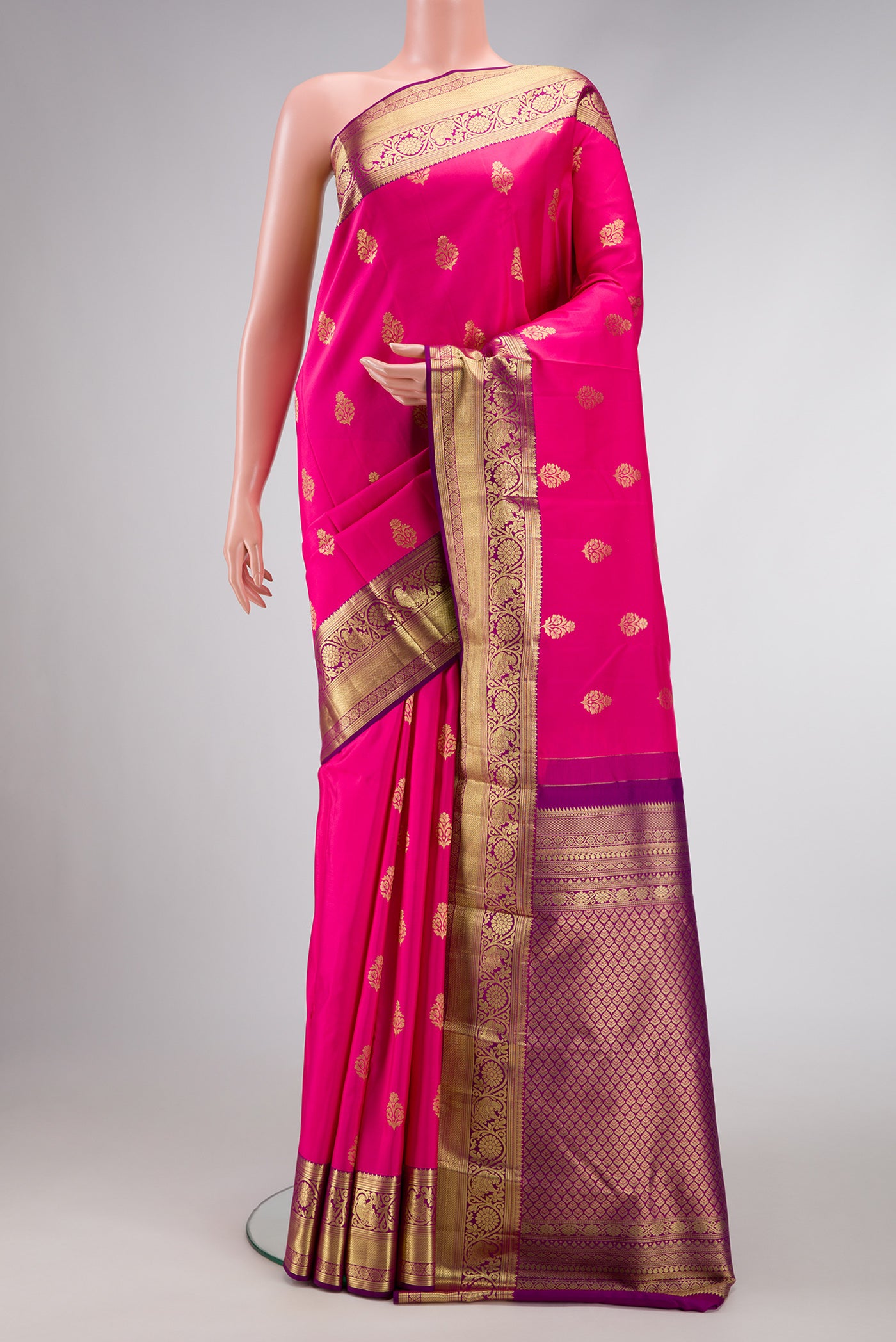 Pink Dual Tone Kanjivaram Silk Saree with Zari Butta on the body and Zari Border.  displayed on a mannequin