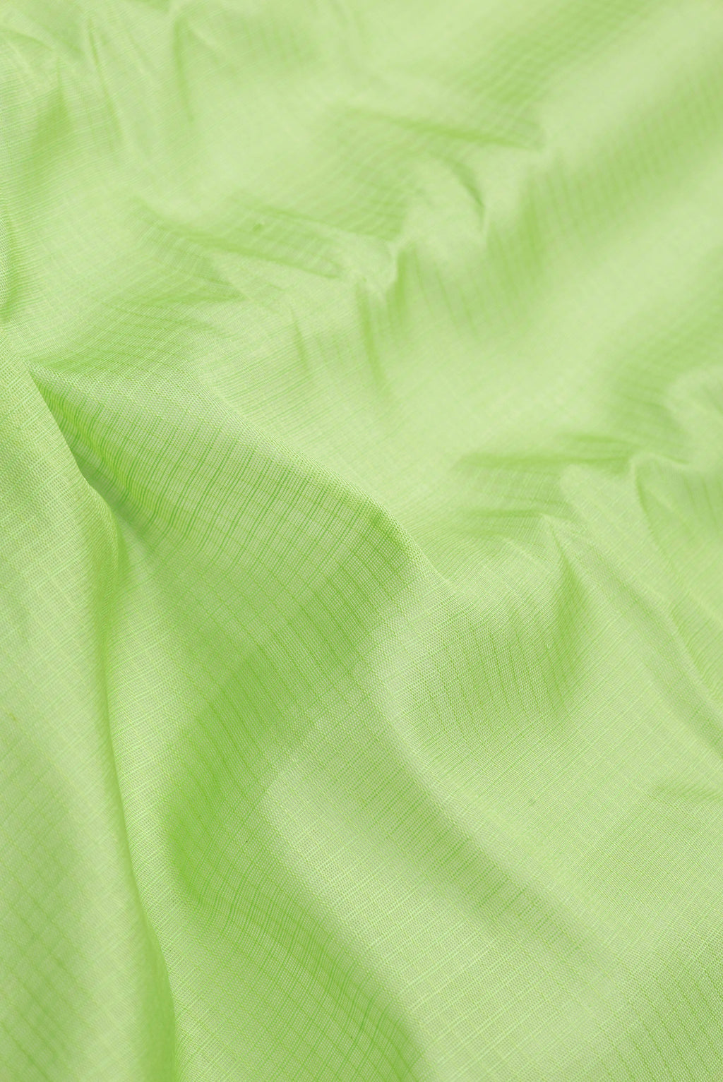 Close up of Parrot Green Dual Tone Gadwal Silk Saree with Checked design on the body and Zari Border.  displaying folds