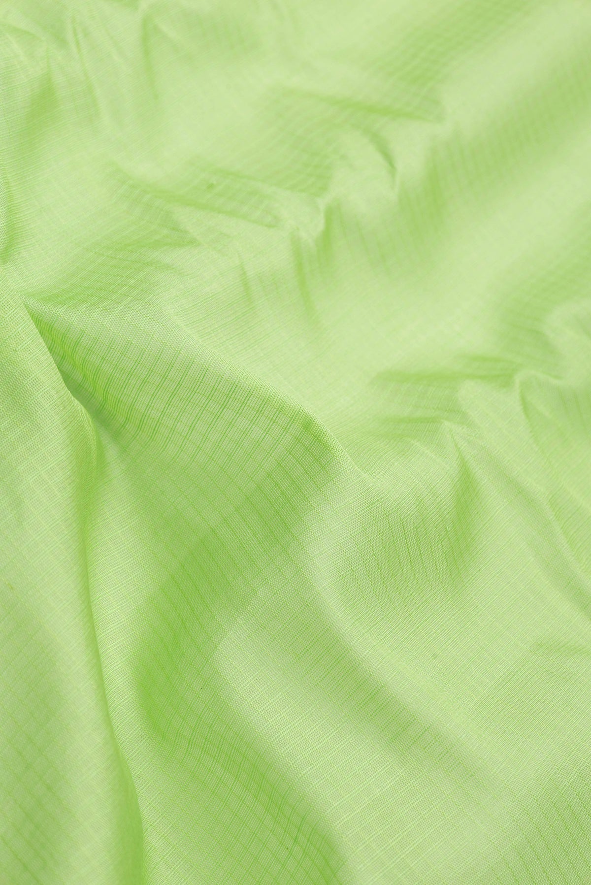 Close up of Parrot Green Dual Tone Gadwal Silk Saree with Checked design on the body and Zari Border.  displaying folds