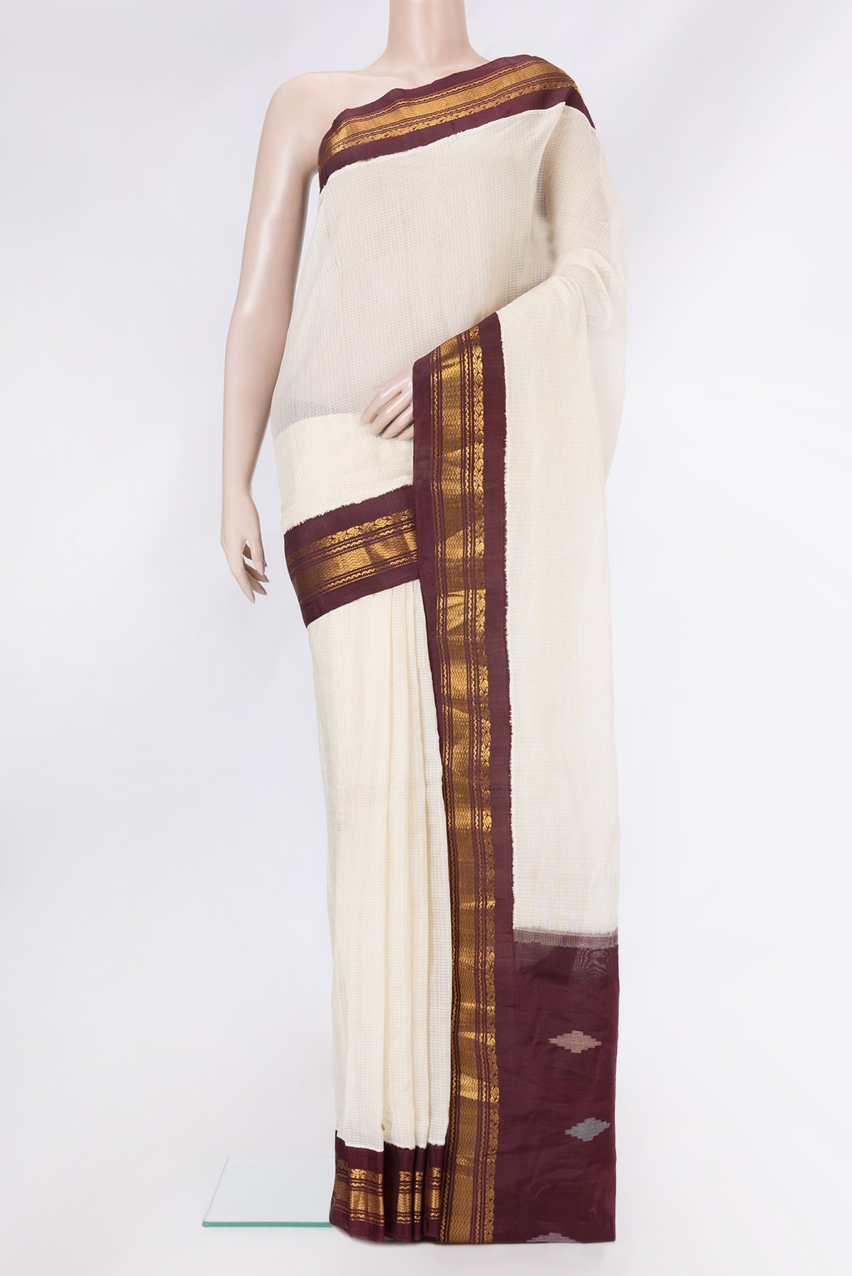 Off White Dual Tone Kanchipuram Silk Saree with Checked design on the body and Zari Border.  displayed on a mannequin