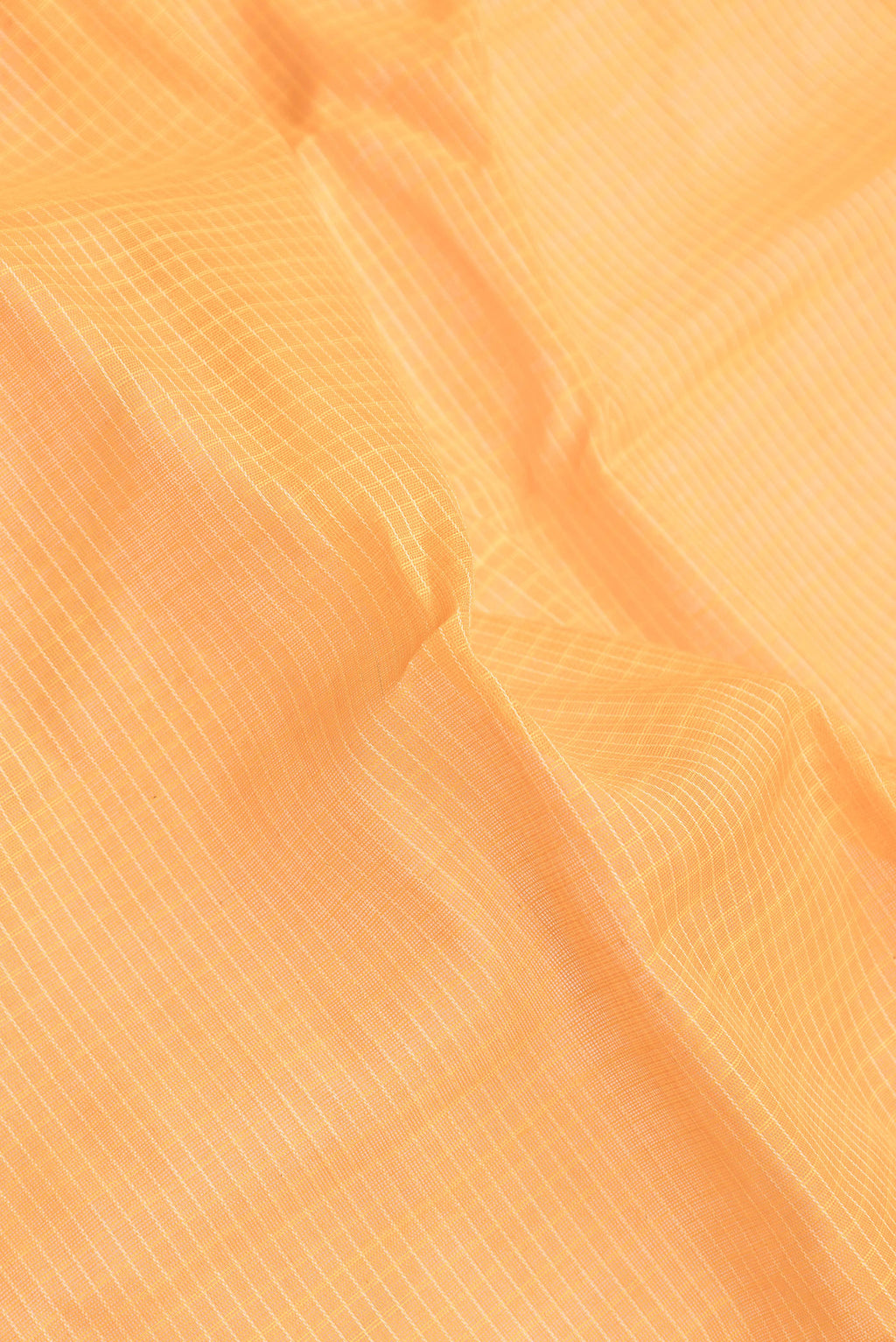 Close up of Orange Dual Tone Gadwal Silk Saree with Checked design on the body and Zari Border.  displaying folds
