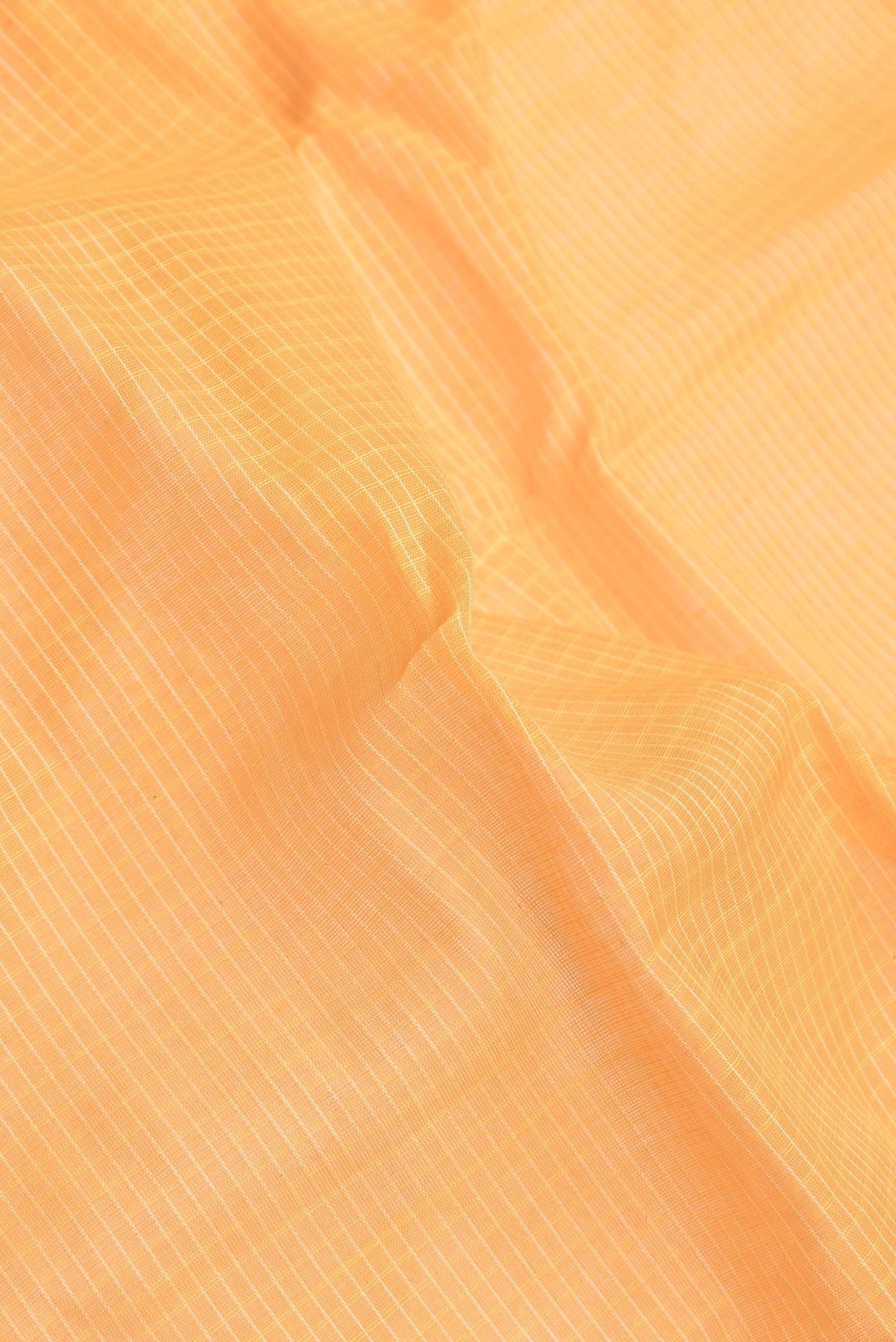 Close up of Orange Dual Tone Gadwal Silk Saree with Checked design on the body and Zari Border.  displaying folds