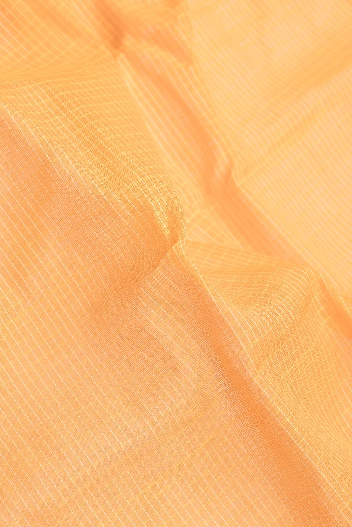 Close up of Orange Dual Tone Gadwal Silk Saree with Checked design on the body and Zari Border.  displaying folds