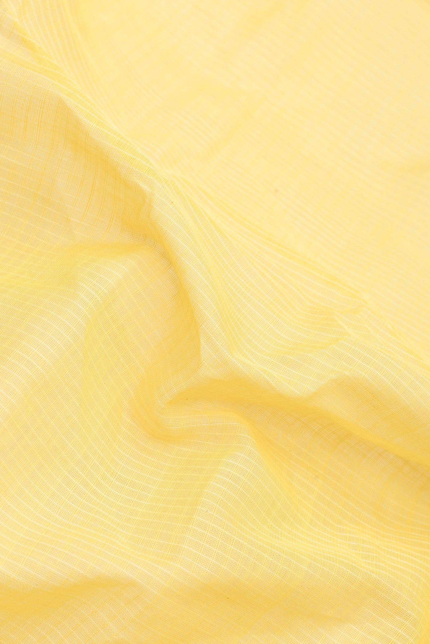 Close up of Yellow Dual Tone Gadwal Silk Saree with Checked design on the body and Zari Border.  displaying folds