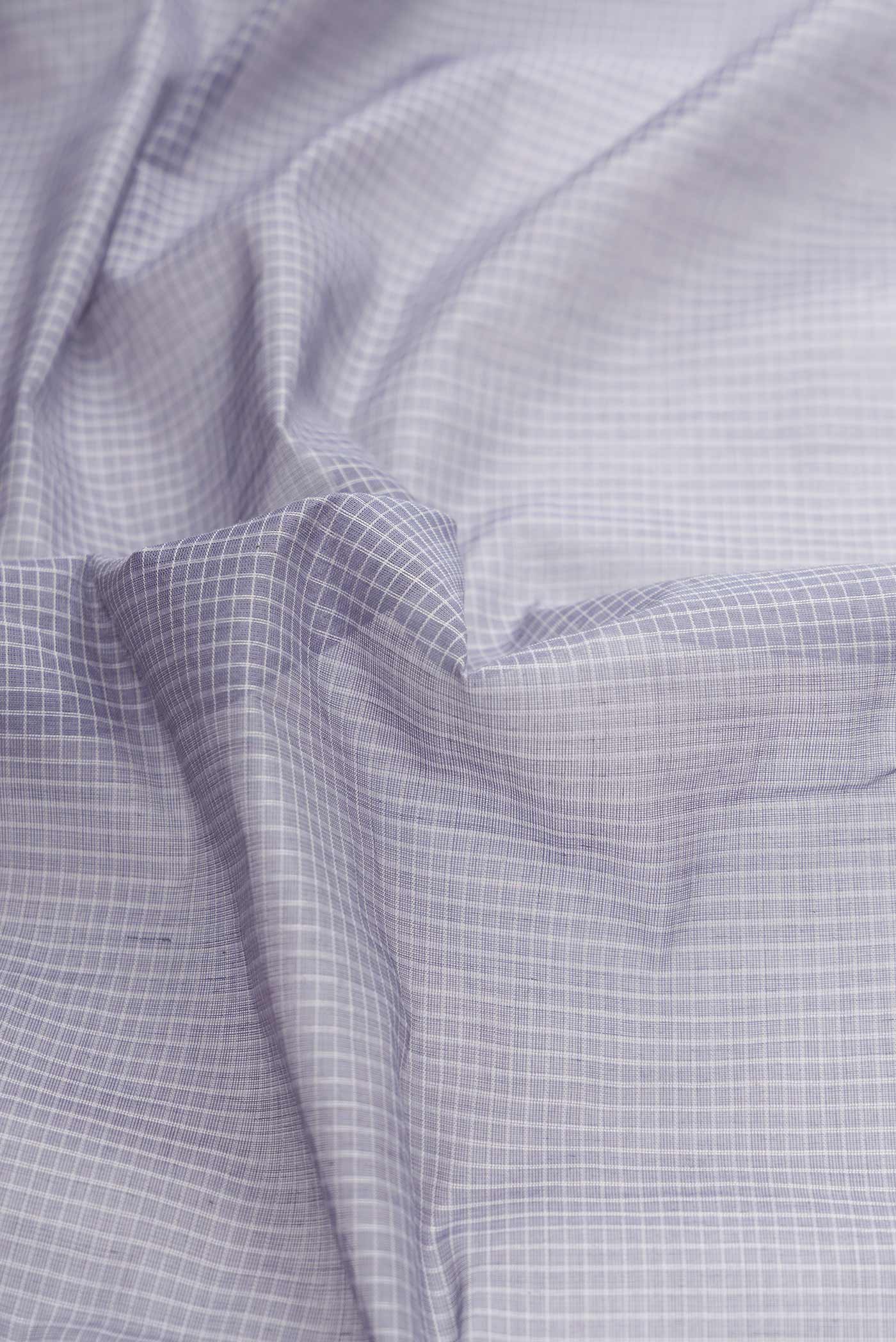 Close up of Light Blue Dual Tone Gadwal cotton Saree with Checked design on the body and Zari Border displaying folds