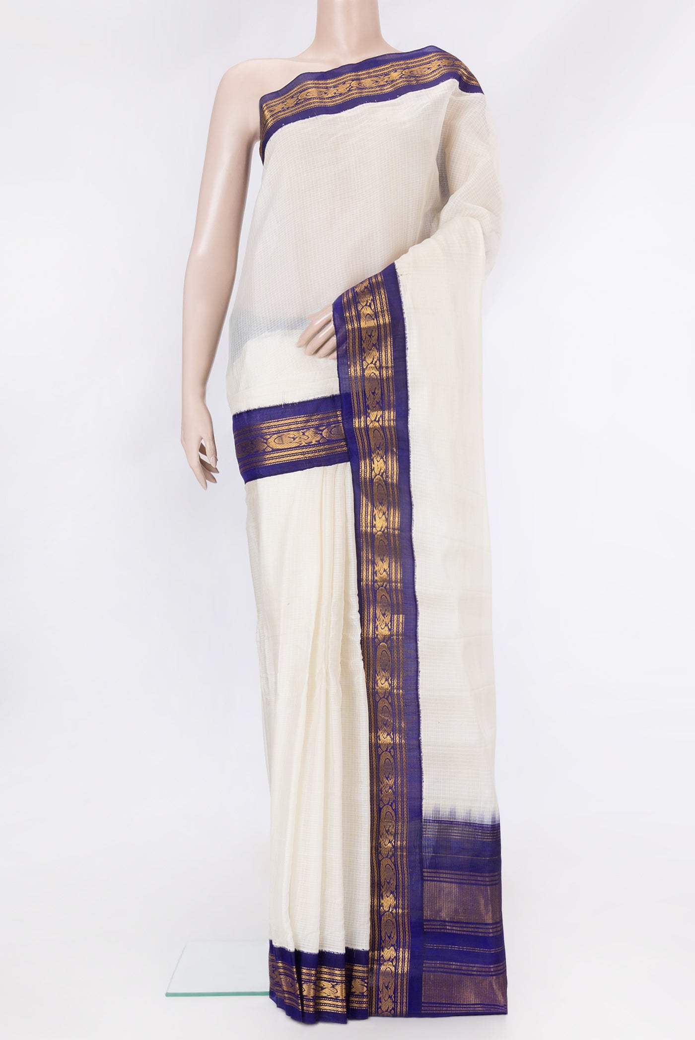 Off White Dual Tone Kanchipuram Silk Saree with Checked design on the body and Zari Border.  displayed on a mannequin