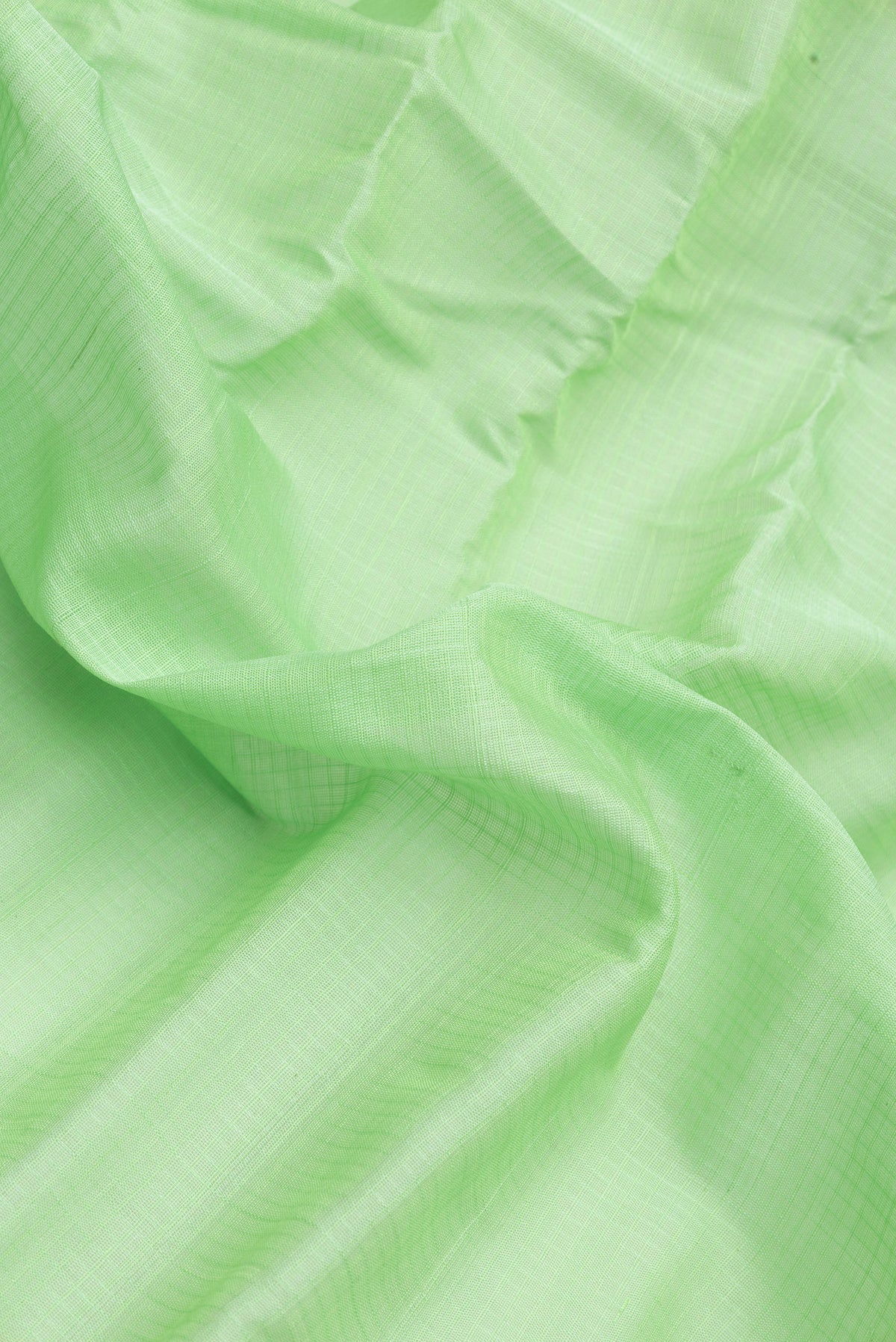 Close up of Sea Green Dual Tone Gadwal Silk Cotton Saree with Checked design on the body and Zari Border.  displaying folds