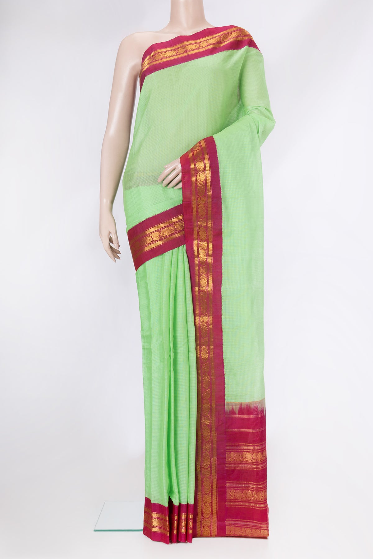 Sea Green Dual Tone Gadwal Silk Cotton Saree with Checked design on the body and Zari Border.  displayed on a mannequin