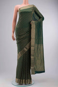 Green Mysore Crepe Saree with Zari Brocade on the body and Zari Border displayed on a mannequin