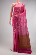 Pink Tussar Silk Saree with Thread Butta on the body and Fancy Border.  displayed on a mannequin