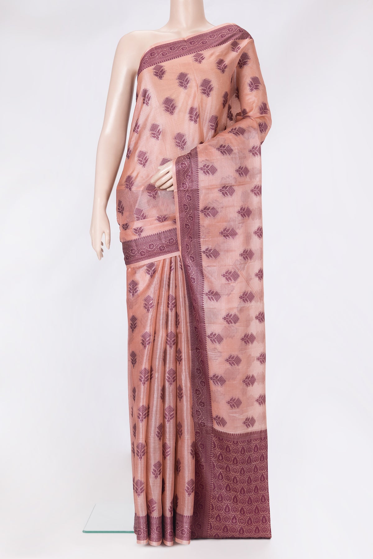 Peach Tussar Silk Saree with Thread Butta on the body and Thread Border.  displayed on a mannequin