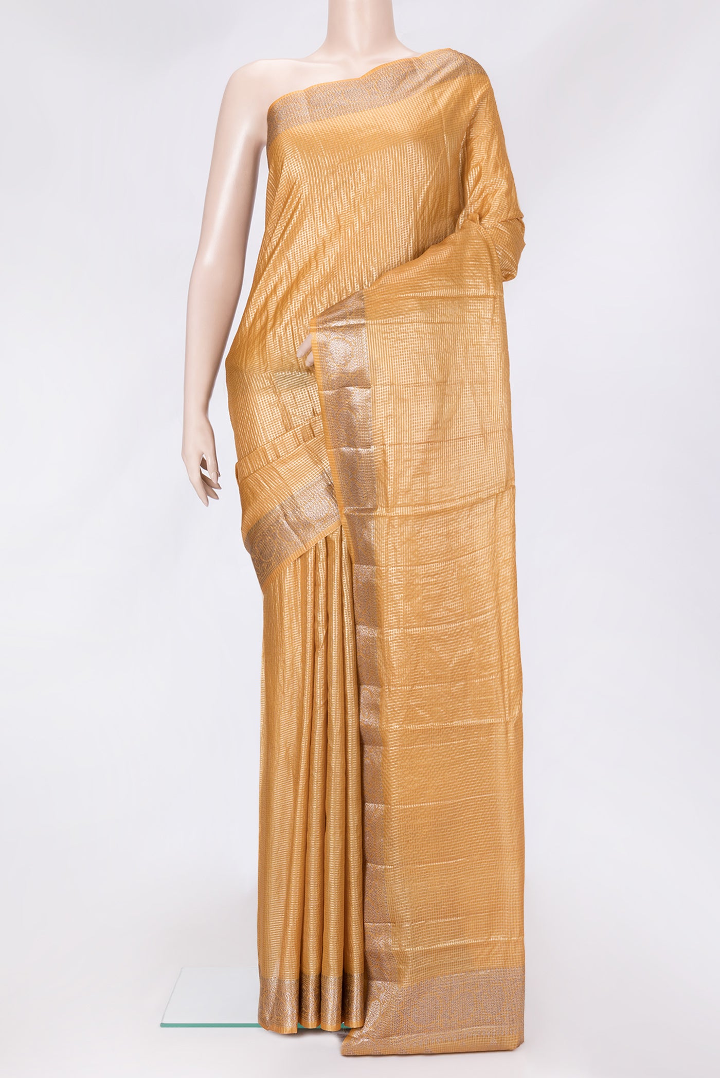 Gold Dual Tone Tussar Silk Saree with Checked design on the body and Zari Border.  displayed on a mannequin