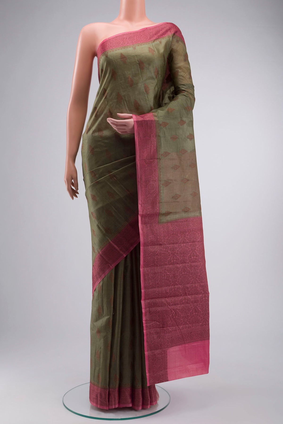 Green Tussar Silk Saree with Zari Butta on the body and Thread Border displayed on a mannequin