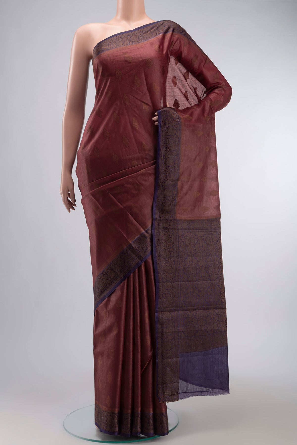 Brown Tussar Silk Saree with Zari Butta on the body and Thread Border displayed on a mannequin