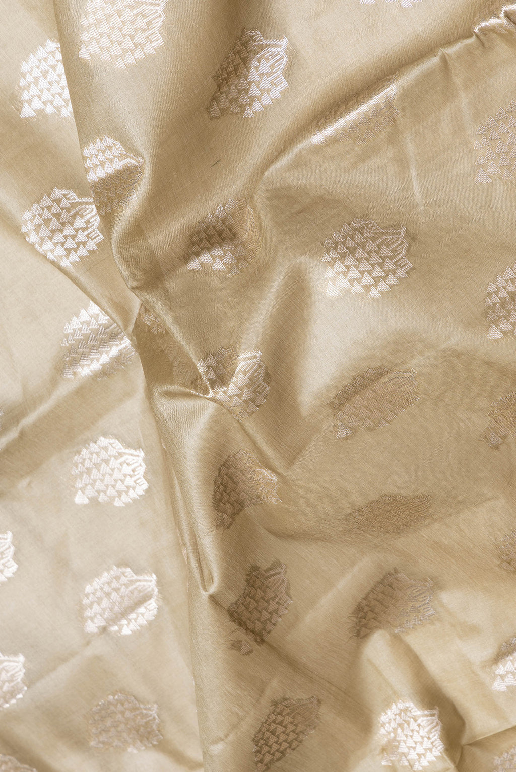 Close up of Mehandi Green Dual Tone Tussar Silk Saree with Zari Butta on the body and Zari Border.  displaying folds