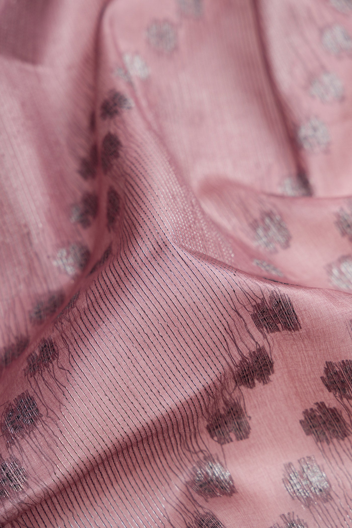 Close up of Mauve Banarasi Tussar Silk Saree with Zari Brocade on the body and Zari Border.  displaying folds