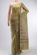 Green Tussar Silk Saree with Zari Butta on the body and Zari Border displayed on a mannequin
