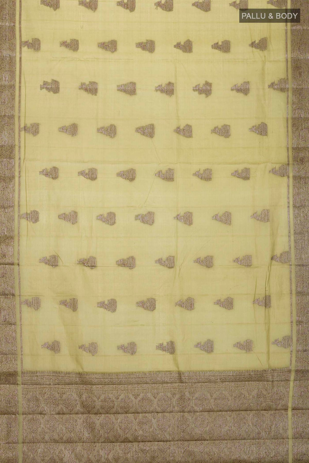 Flat view of Green Tussar Silk Saree with Zari Butta on the body and Zari Border