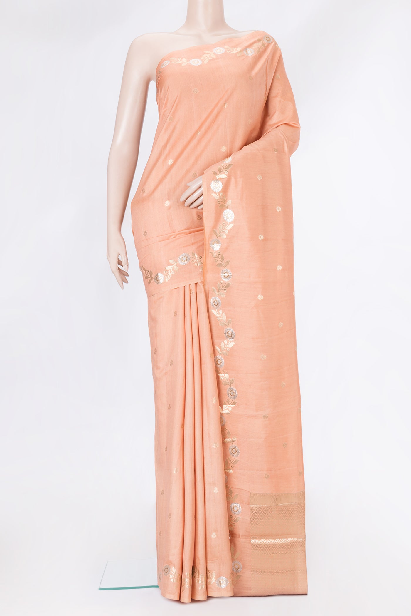 Golden Peach Dual Tone Tussar Silk Saree with Zari Butta on the body and Zari Border.  displayed on a mannequin