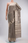 Grey Banarasi Raw Silk Saree with Zari Butta on the body and Zari Border displayed on a mannequin