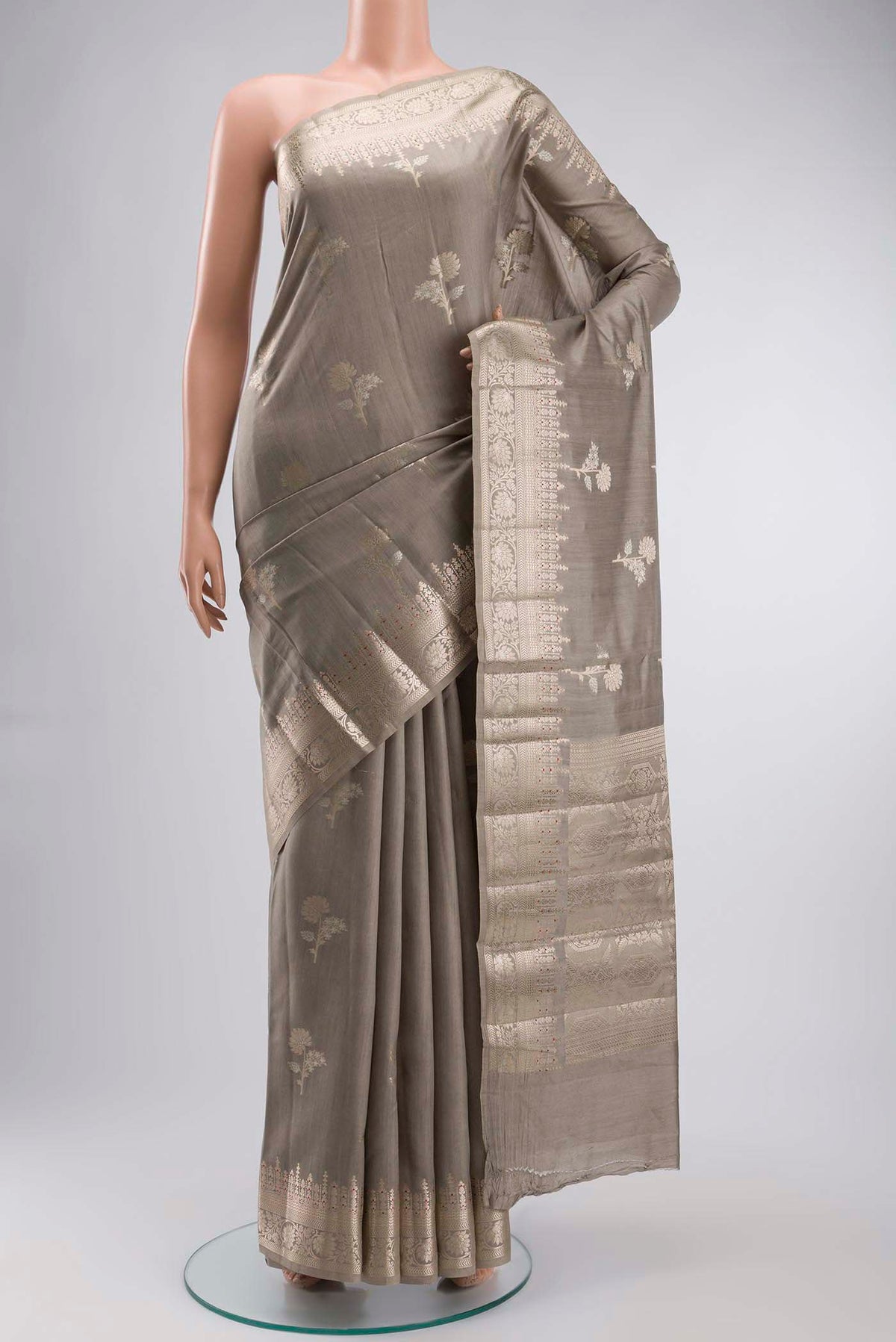Grey Banarasi Raw Silk Saree with Zari Butta on the body and Zari Border displayed on a mannequin