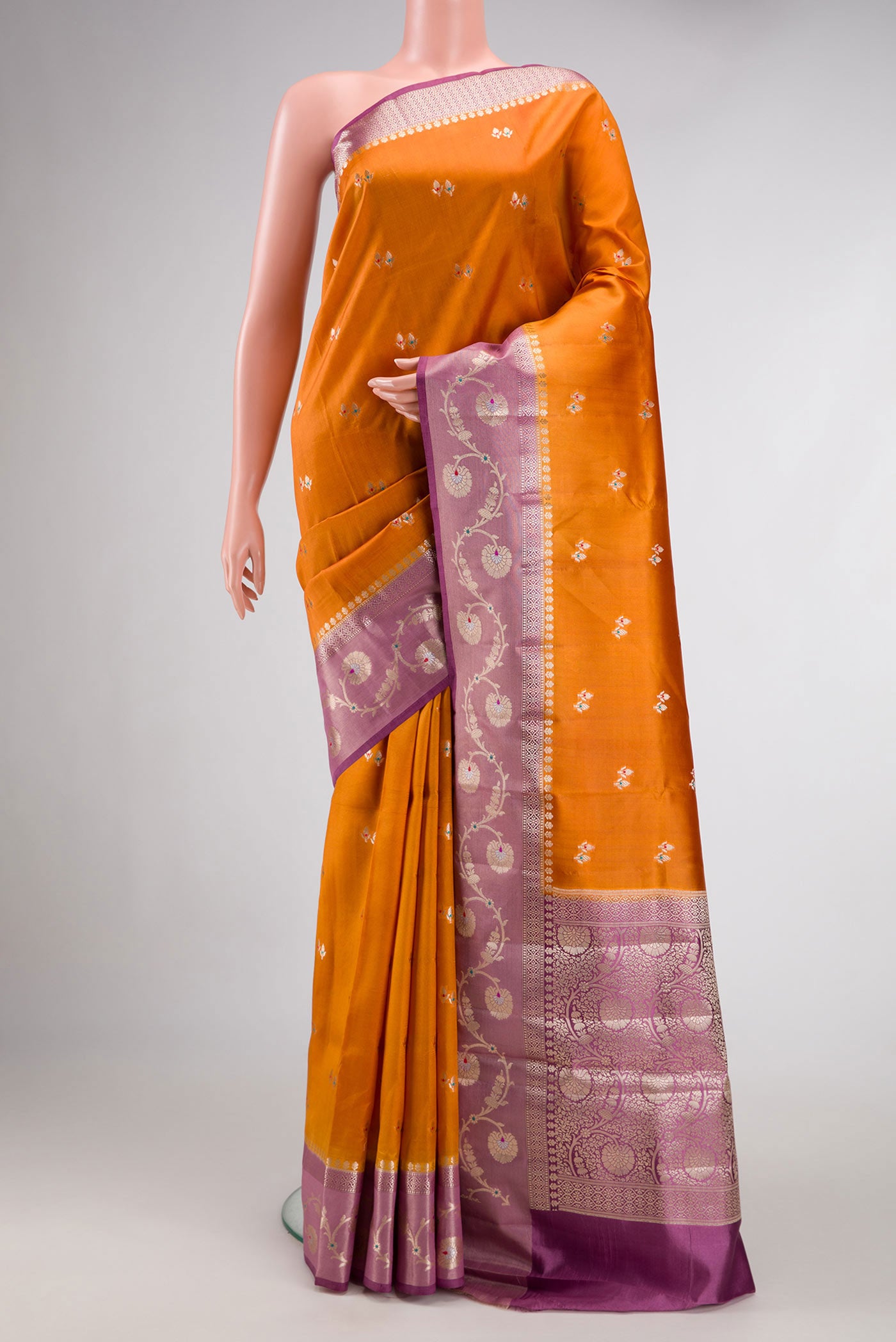 Mustard Dual Tone Tussar Silk Saree with Zari Butta on the body and Zari Border.  displayed on a mannequin