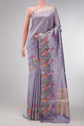Grey Dual Tone Tussar Silk Saree with Zari Butta on the body and Fancy Border.  displayed on a mannequin