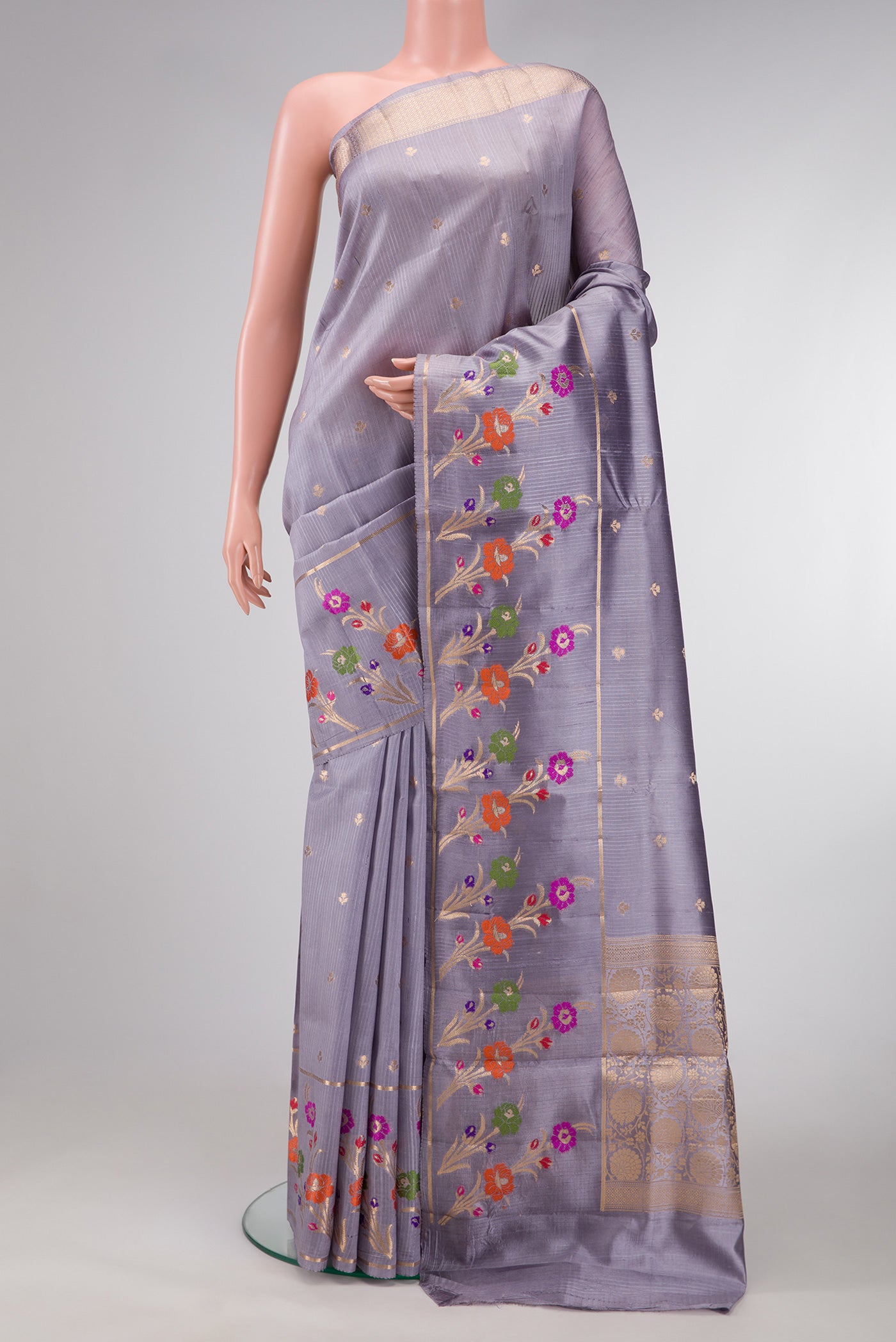 Grey Dual Tone Tussar Silk Saree with Zari Butta on the body and Fancy Border.  displayed on a mannequin